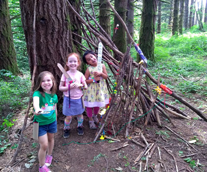 Campers love to explore the woods and build forts and teepees at Camp Windy Hill.